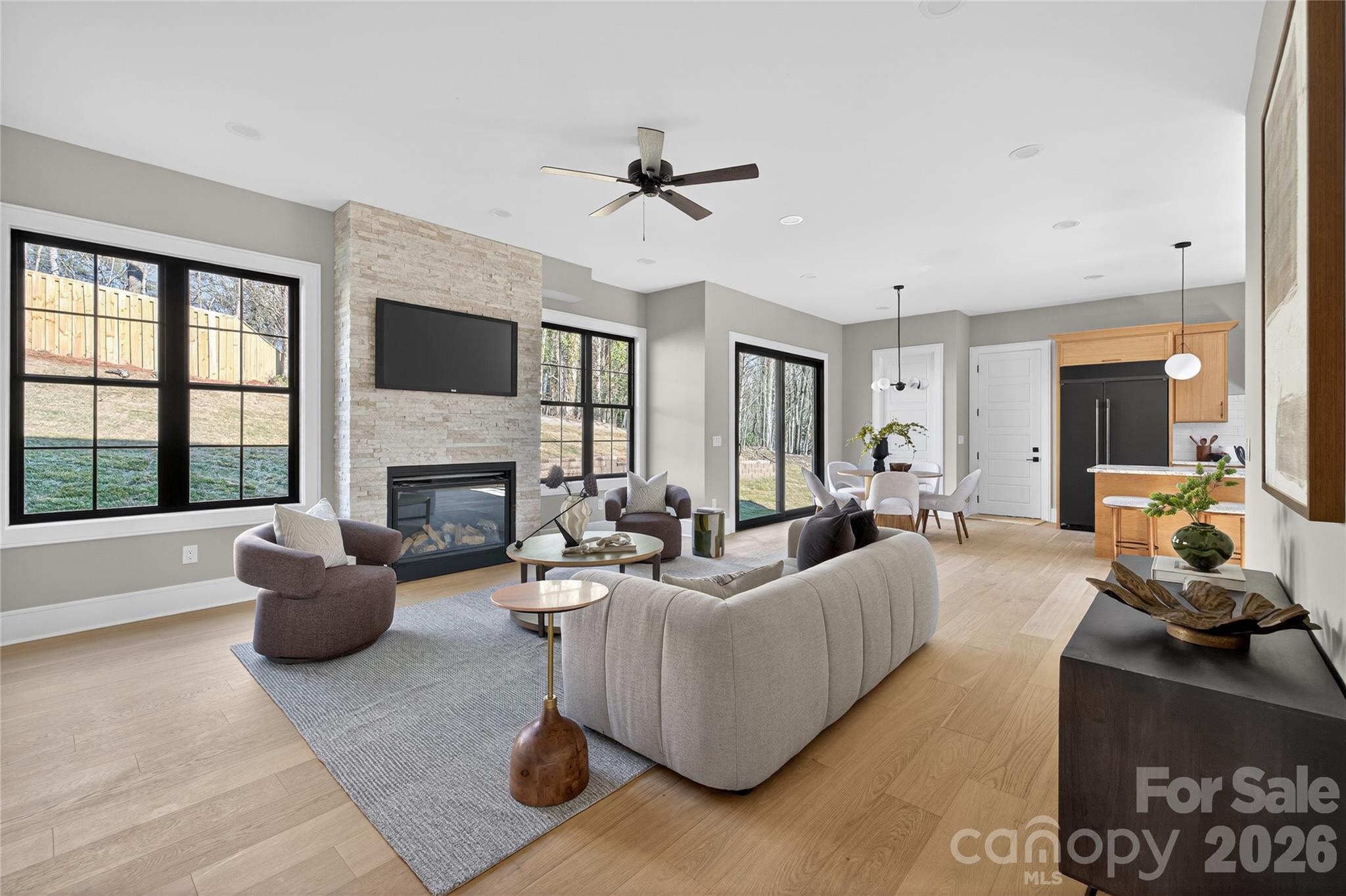 6811 Burlwood Road Charlotte, NC 28211 - Photo 13 of 43 a living room with furniture fireplace and a large window