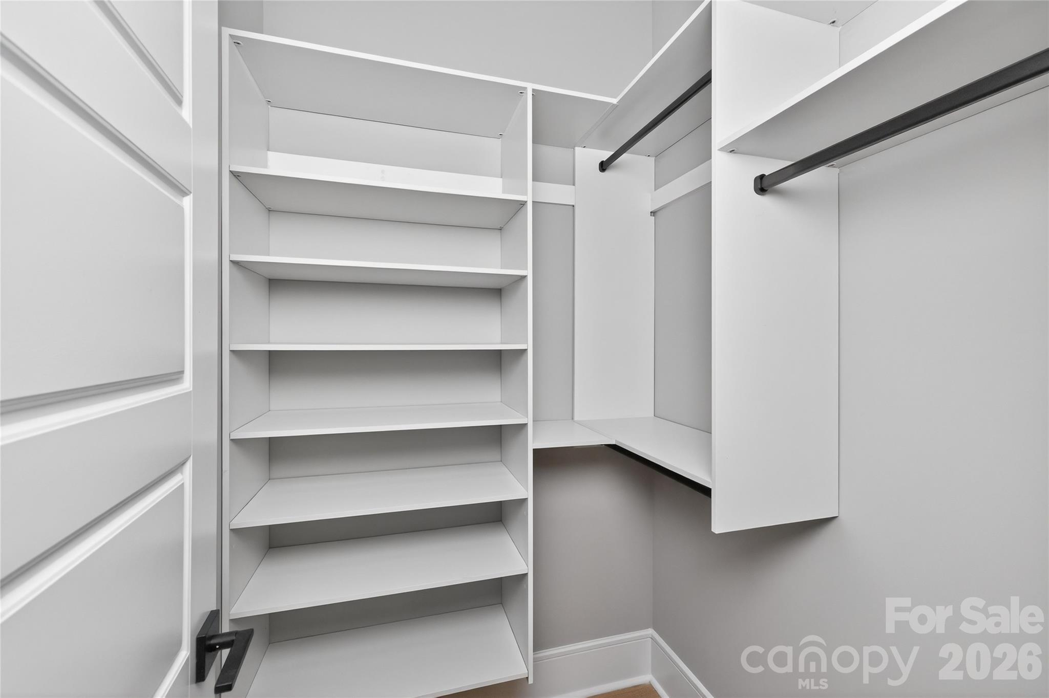 6811 Burlwood Road Charlotte, NC 28211 - Photo 21 of 43 a view of walk in closet with empty racks