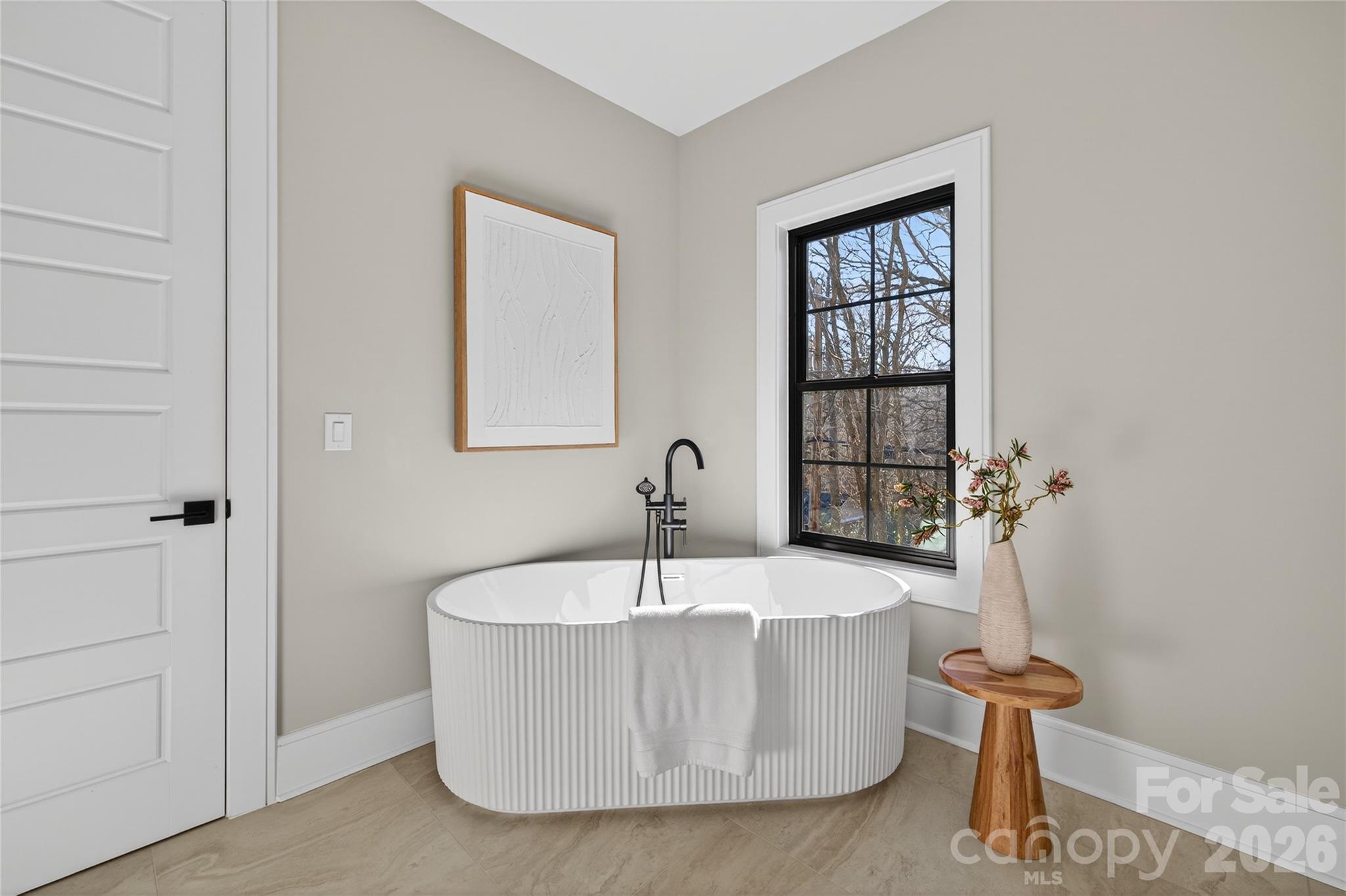 6811 Burlwood Road Charlotte, NC 28211 - Photo 26 of 43 a white bath tub sitting in a bathroom