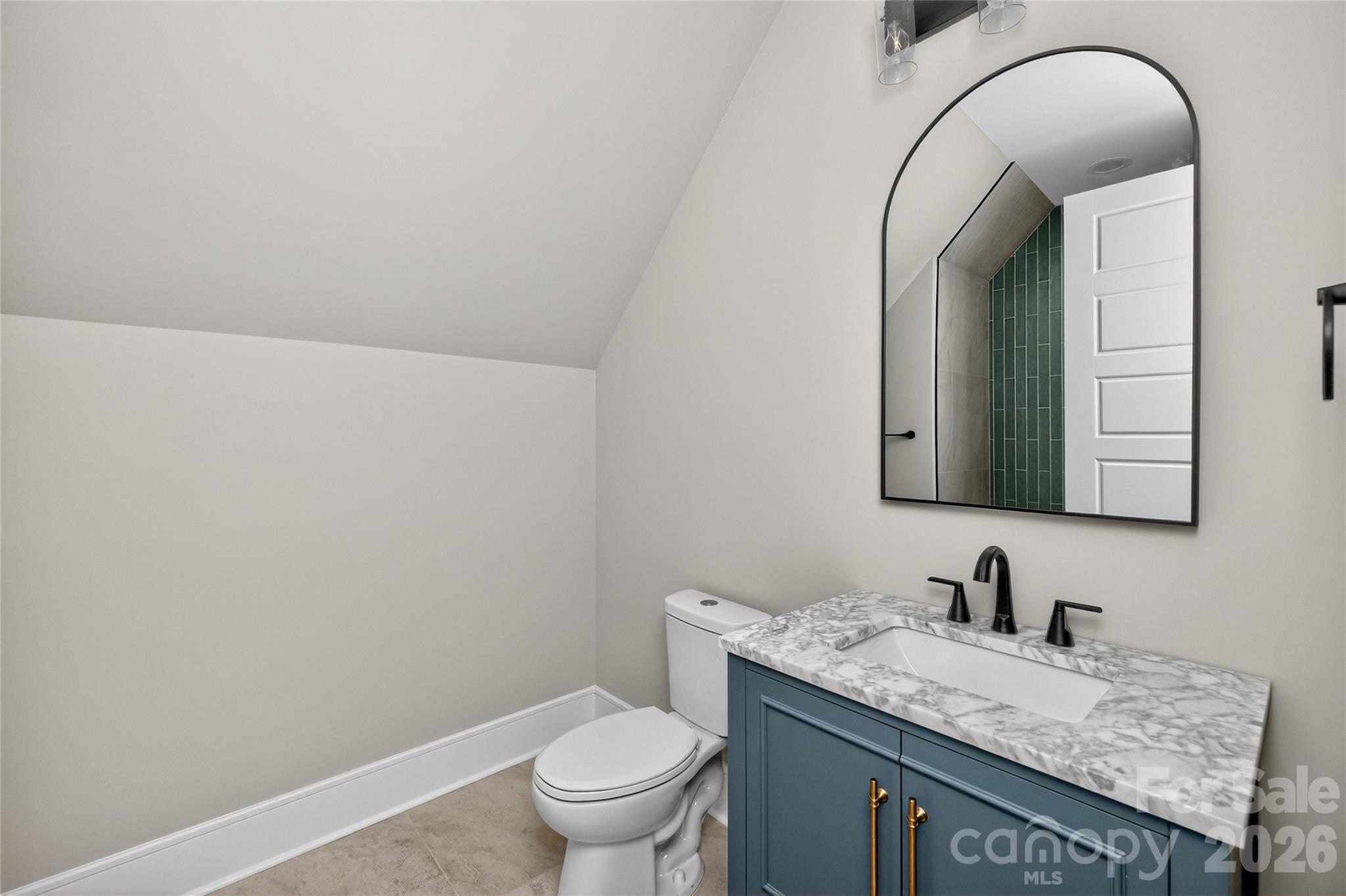 6811 Burlwood Road Charlotte, NC 28211 - Photo 32 of 43 a bathroom with a granite countertop sink and a mirror