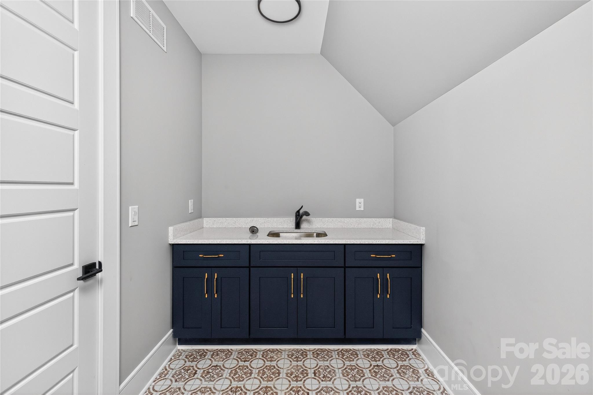 6811 Burlwood Road Charlotte, NC 28211 - Photo 35 of 43 a bathroom with a sink and a mirror