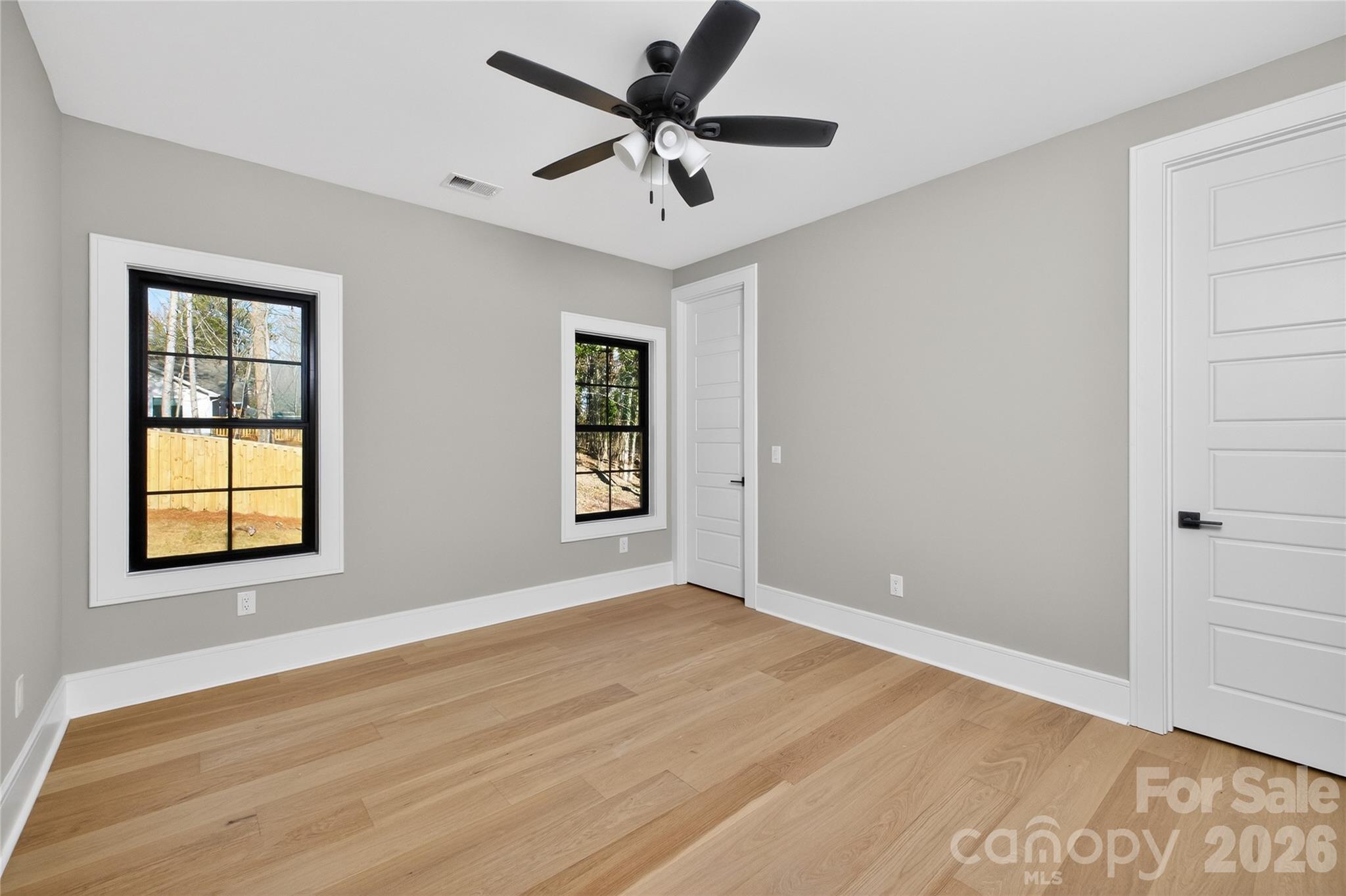 6811 Burlwood Road Charlotte, NC 28211 - Photo 36 of 43 wooden floor in an empty room with a window