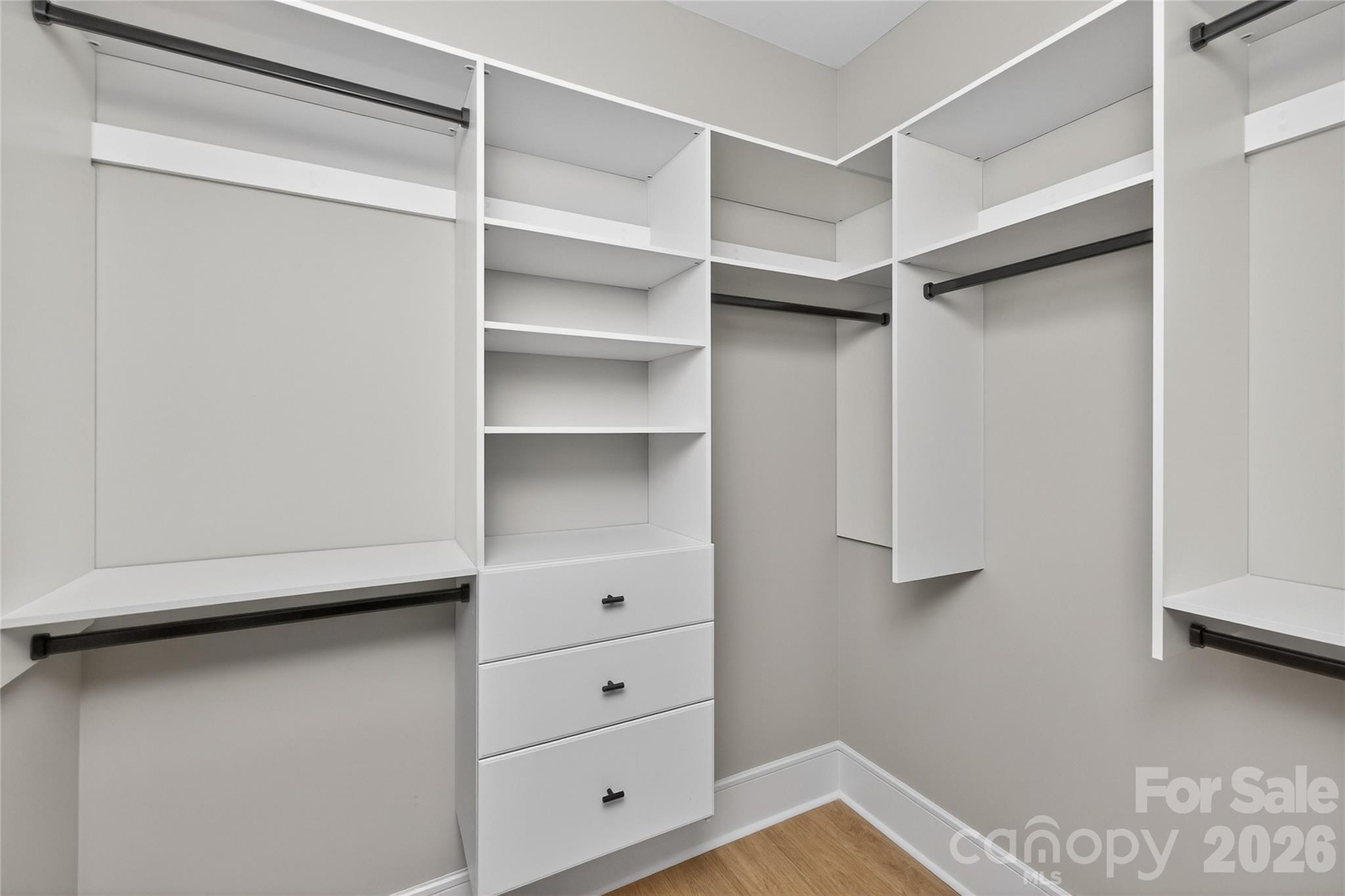 6811 Burlwood Road Charlotte, NC 28211 - Photo 38 of 43 a view of walk in closet with empty racks