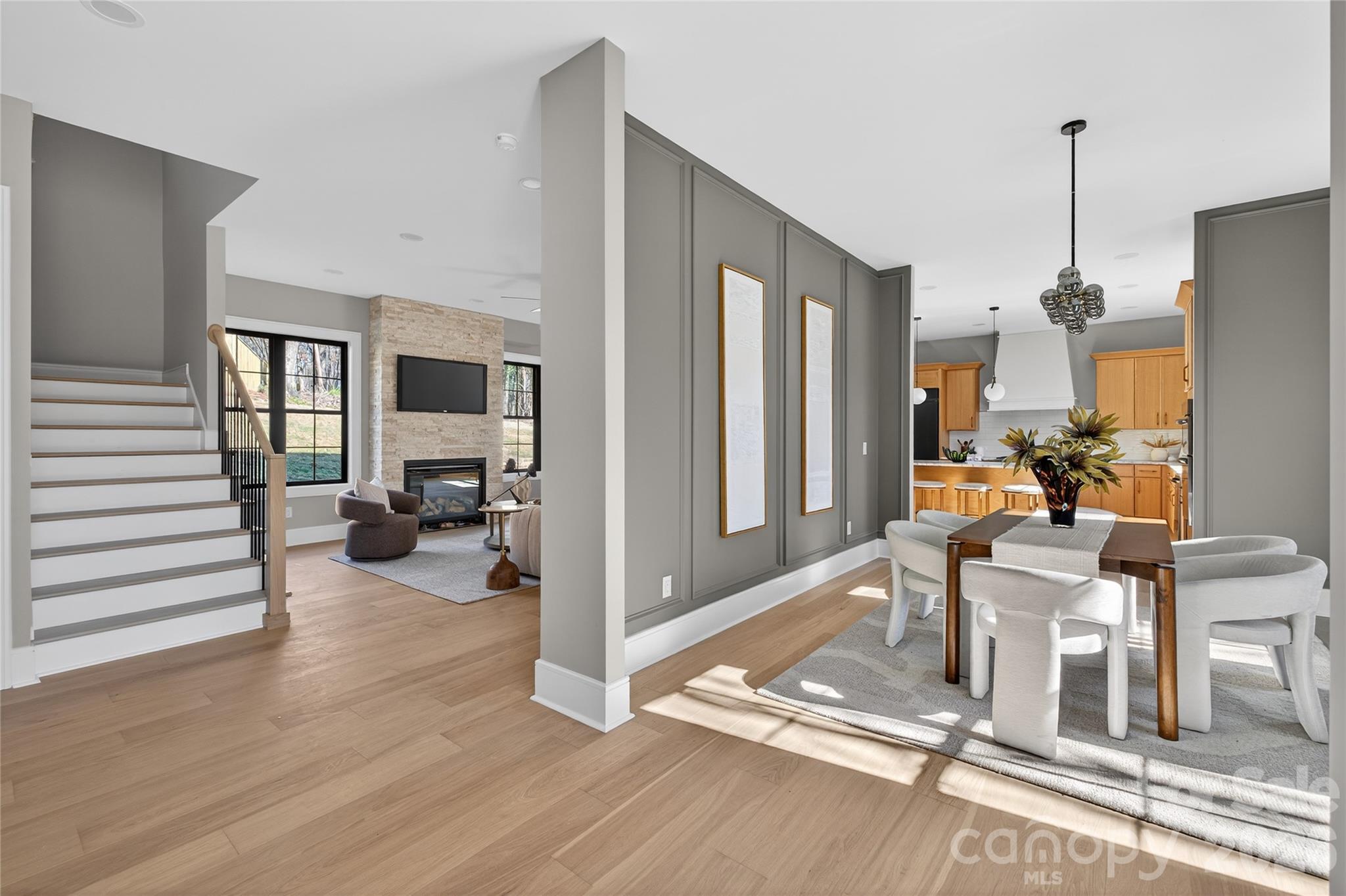 6811 Burlwood Road Charlotte, NC 28211 - Photo 4 of 43 a living room filled with furniture and a wooden floor