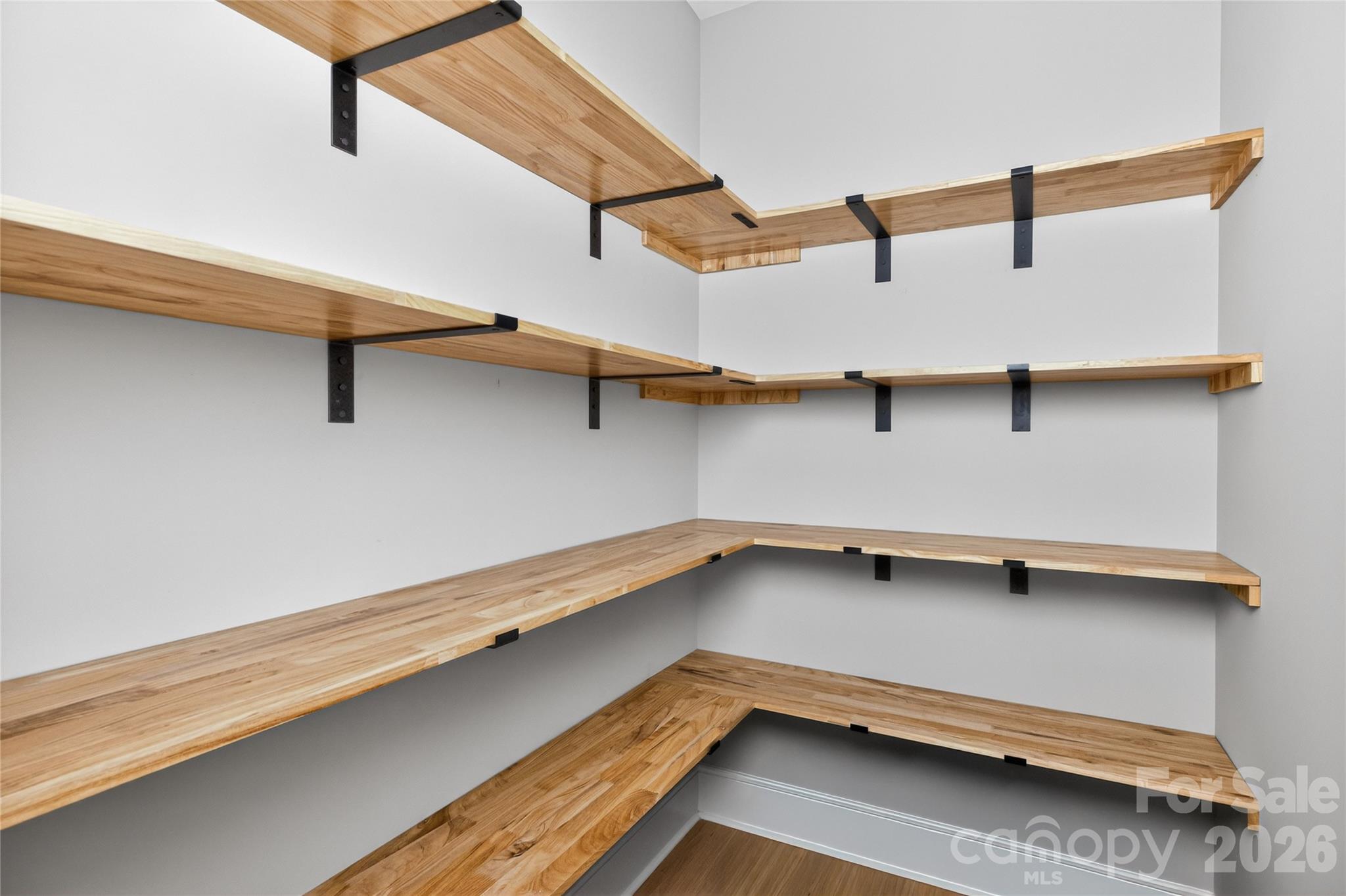 6811 Burlwood Road Charlotte, NC 28211 - Photo 10 of 43 a view of room with stairs and wooden floor