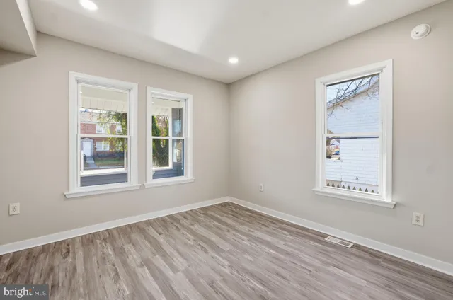 a bathroom with a sink mirror and toilet