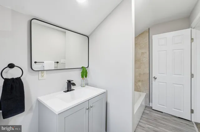 a white toilet sitting next to a bathroom sink