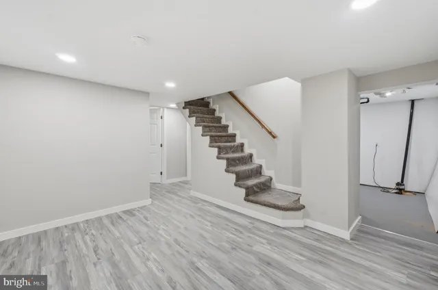 a white bath tub sitting next to a toilet