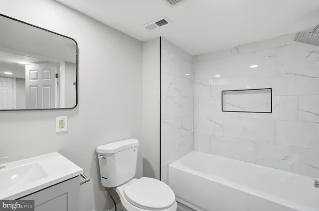 a view of a house with a yard patio and sitting area