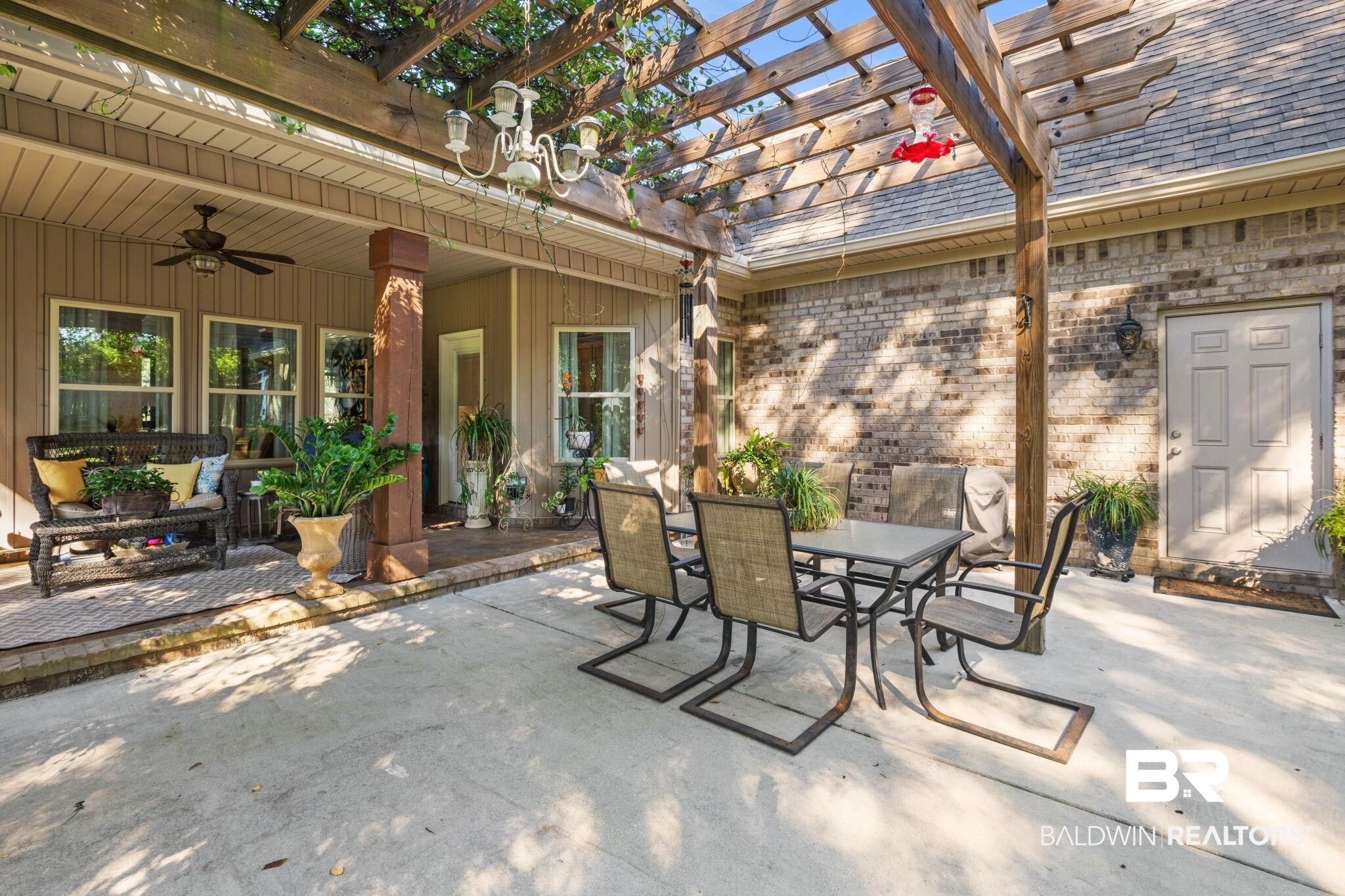 4331 Hamilton Oaks Lane Mobile, AL 36695 - Photo 25 of 38 View of patio / terrace with outdoor dining area, ceiling fan, and a pergola