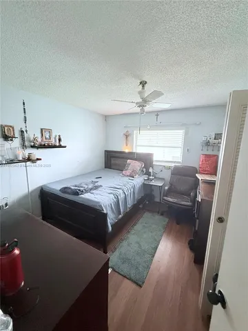 a bedroom with a bed and couch