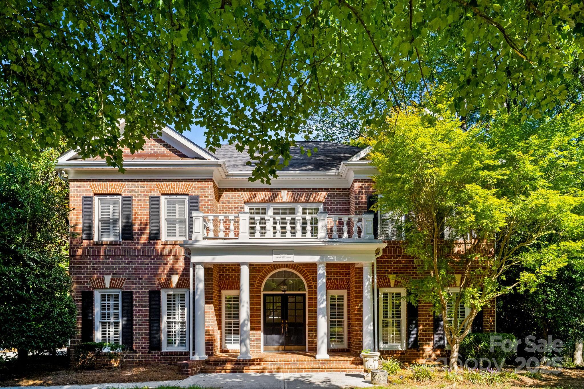 a front view of a building with garden