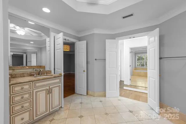 a bathroom with a granite countertop sink a mirror and a