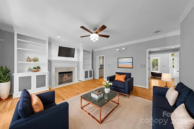 a living room with furniture and a fireplace