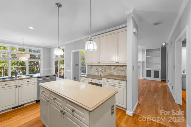 a kitchen with a stove a sink and a refrigerator