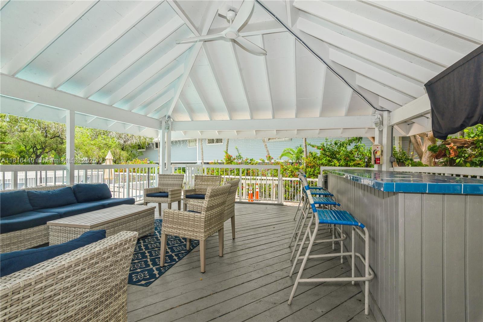 798 Crandon Boulevard, Unit 55B Key Biscayne, FL 33149 - Photo 5 of 8 a dining room with furniture window and wooden floor