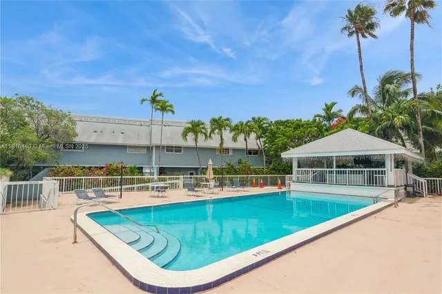a view of a swimming pool with a patio