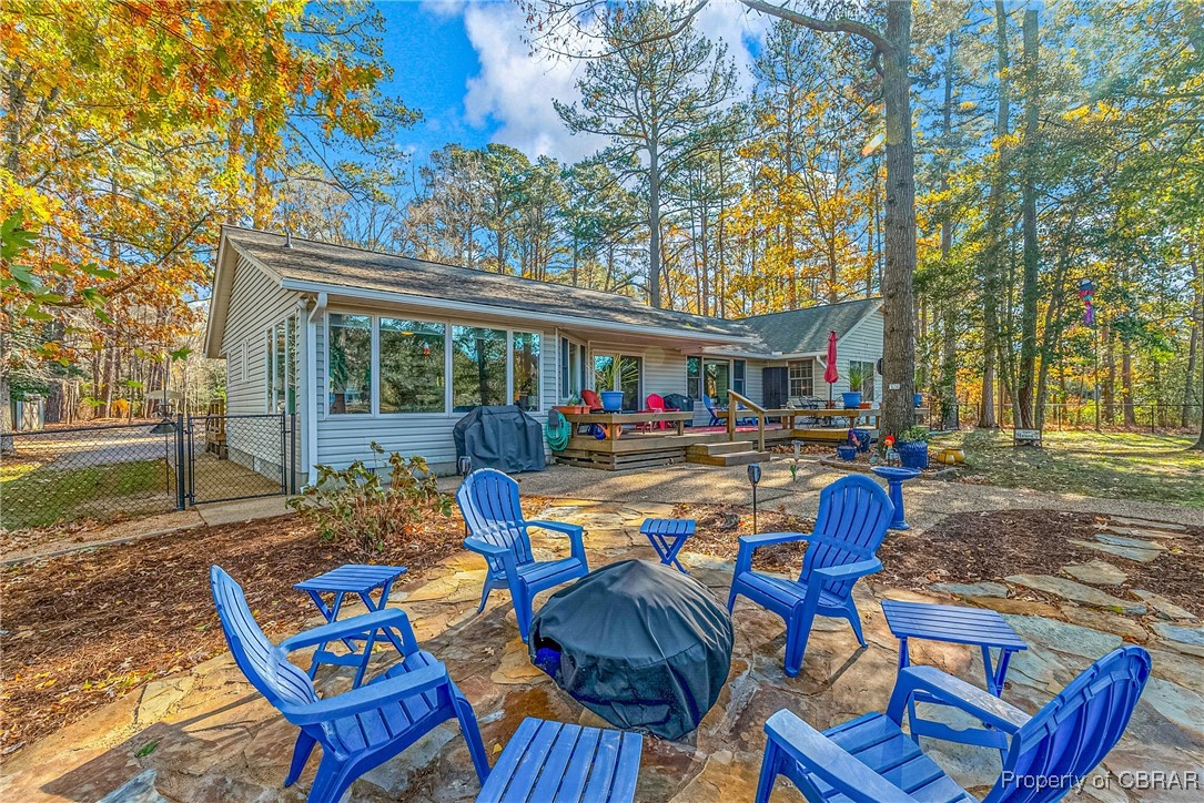 867 Holly Point Road Mathews, VA 23109 - Photo 44 of 48 View of patio featuring fire pit overlooking the water