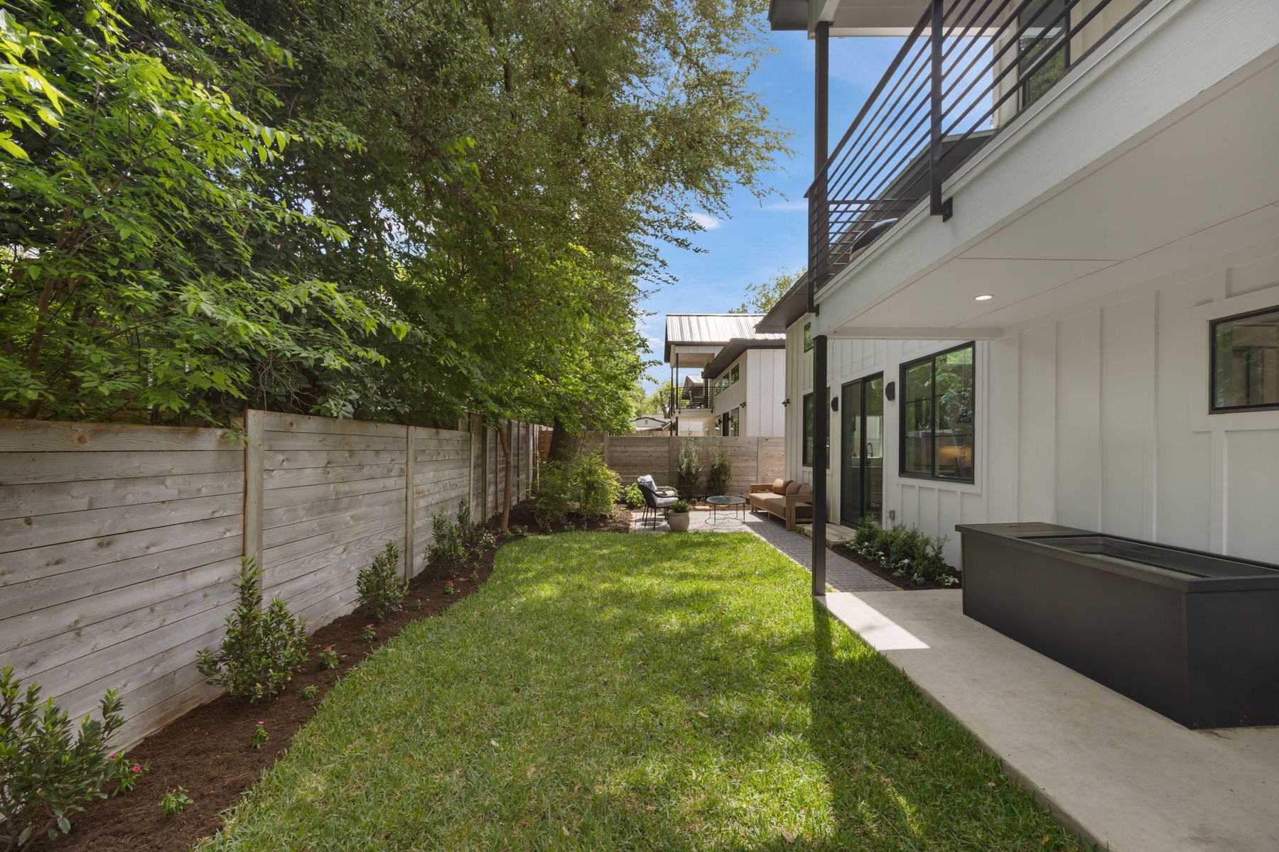 2711 Stacy Lane, Unit 2 Austin, TX 78704 - Photo 22 of 26 Fenced backyard featuring a balcony and a patio area