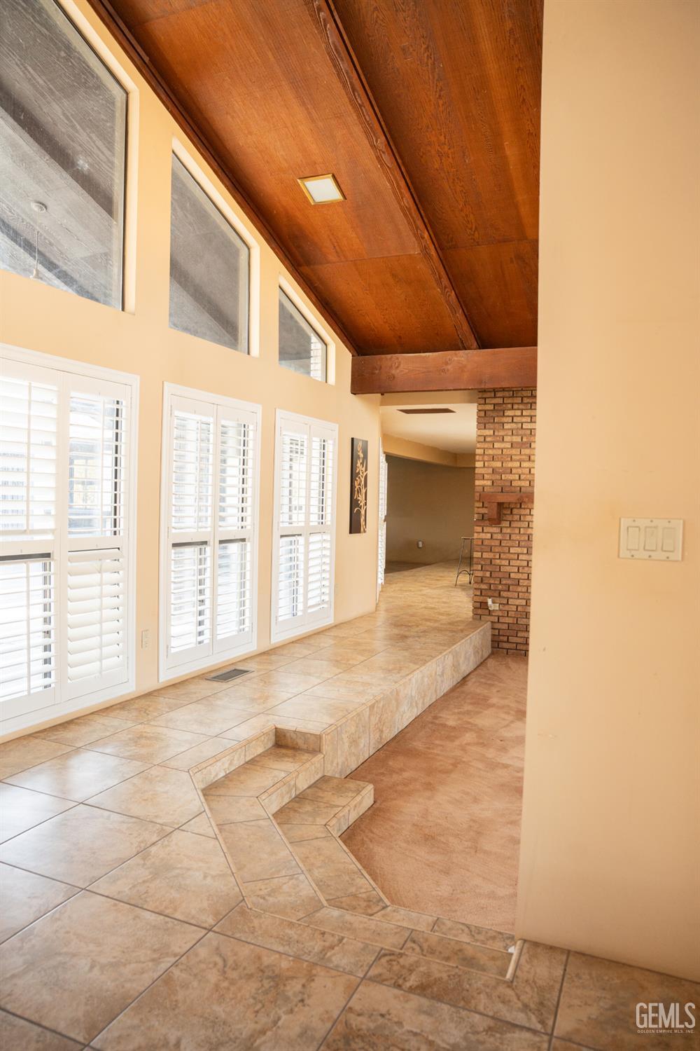 Undisclosed Address Bakersfield, CA 93308 - Photo 10 of 29 a view of an empty room with a fireplace
