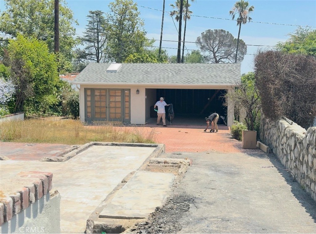 948 East Poppyfields Drive Altadena, CA 91001 - Photo 3 of 3 a view of a house with a yard and garage