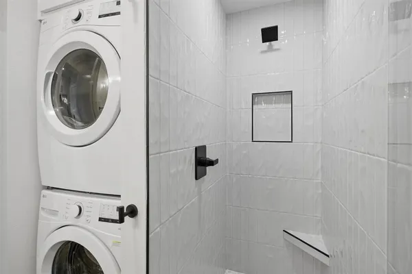 a view of a hallway with washer and dryer