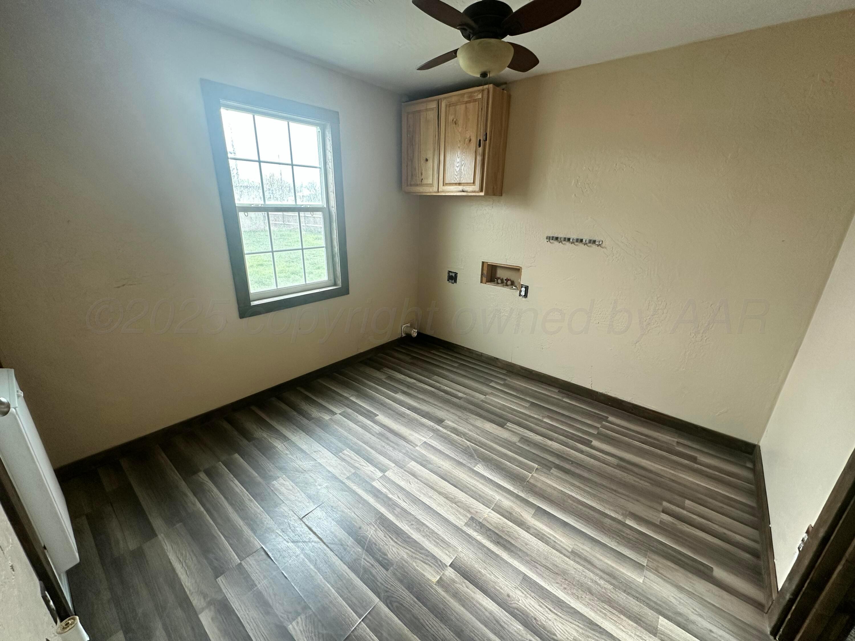 709 Flora Avenue Panhandle, TX 79068 - Photo 5 of 19 an empty room with windows