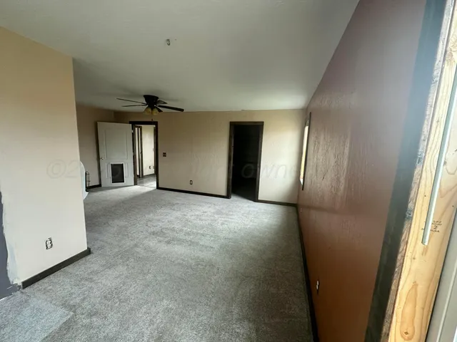 a view of a hallway with windows