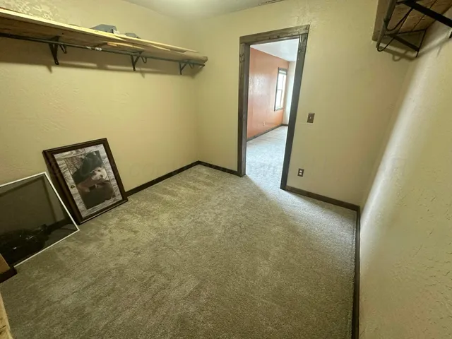 a view of a room with wooden door