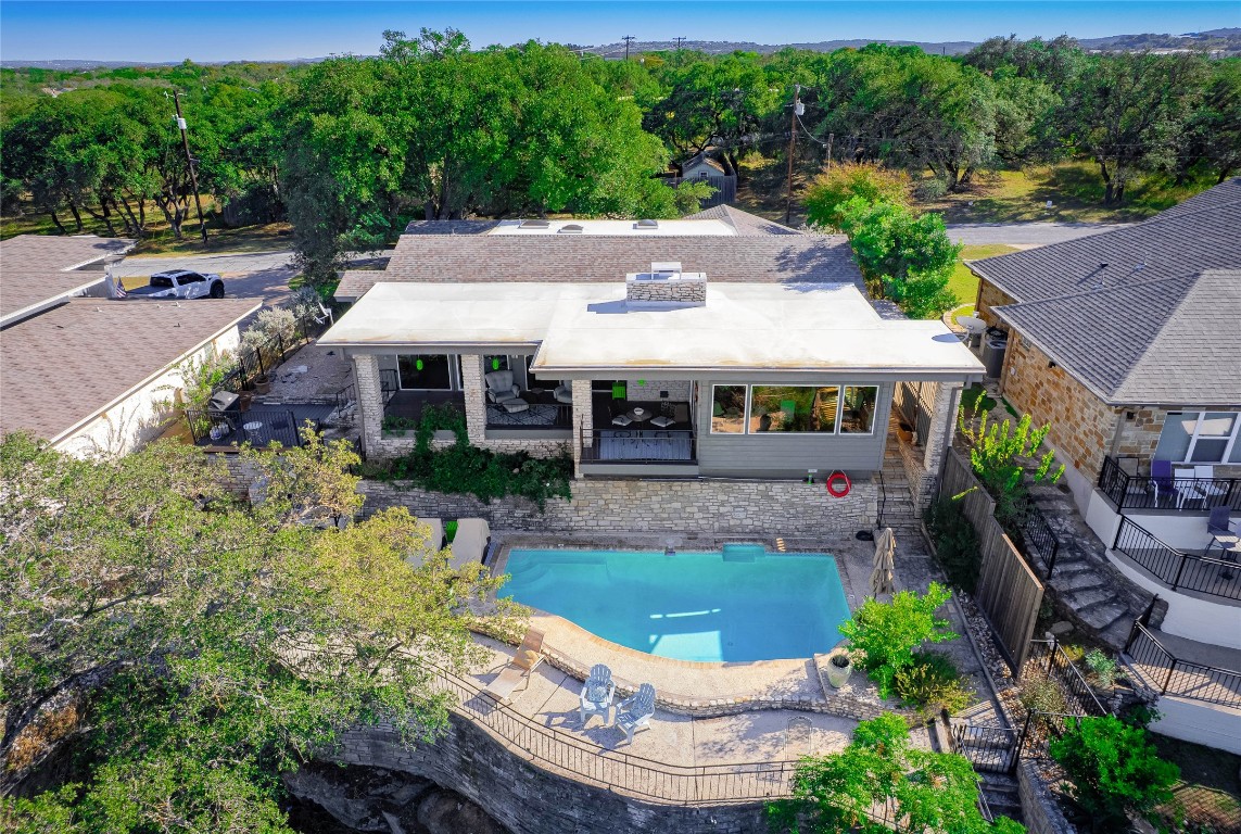an aerial view of a house with garden space and street view