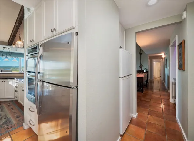 a view of a kitchen from the hallway