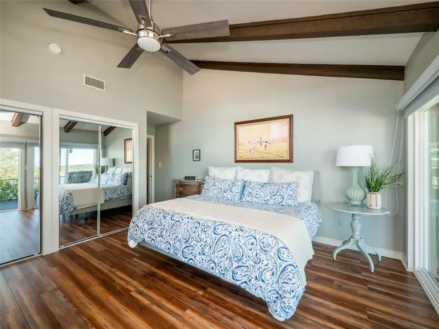 a bedroom with a bed and a table