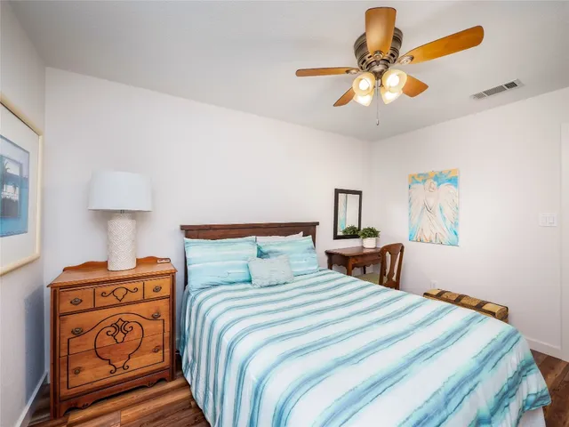 a bedroom with bed and window