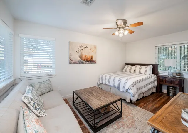 a bedroom with furniture and a window