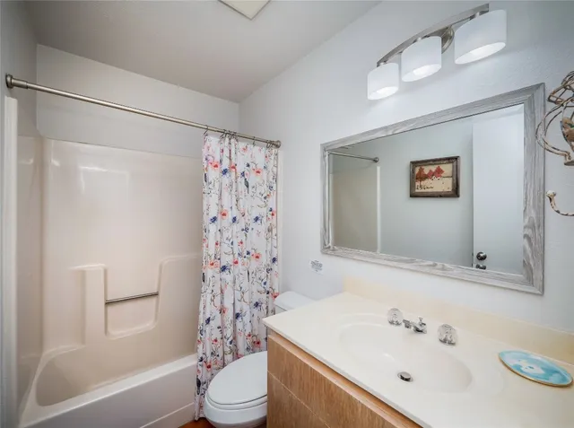 a bathroom with a sink a toilet and a bathtub
