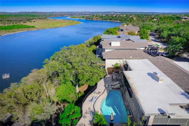 an aerial view of a house with a lake view
