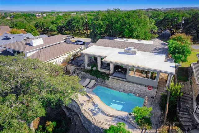 an aerial view of a house with a garden