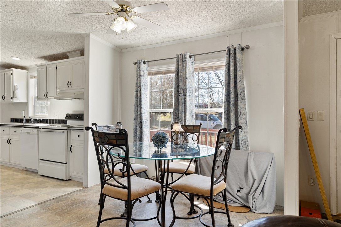 811 Pine Grove Road Seneca, SC 29678 - Photo 5 of 20 This bright kitchen and dining area offers functional design for everyday living.