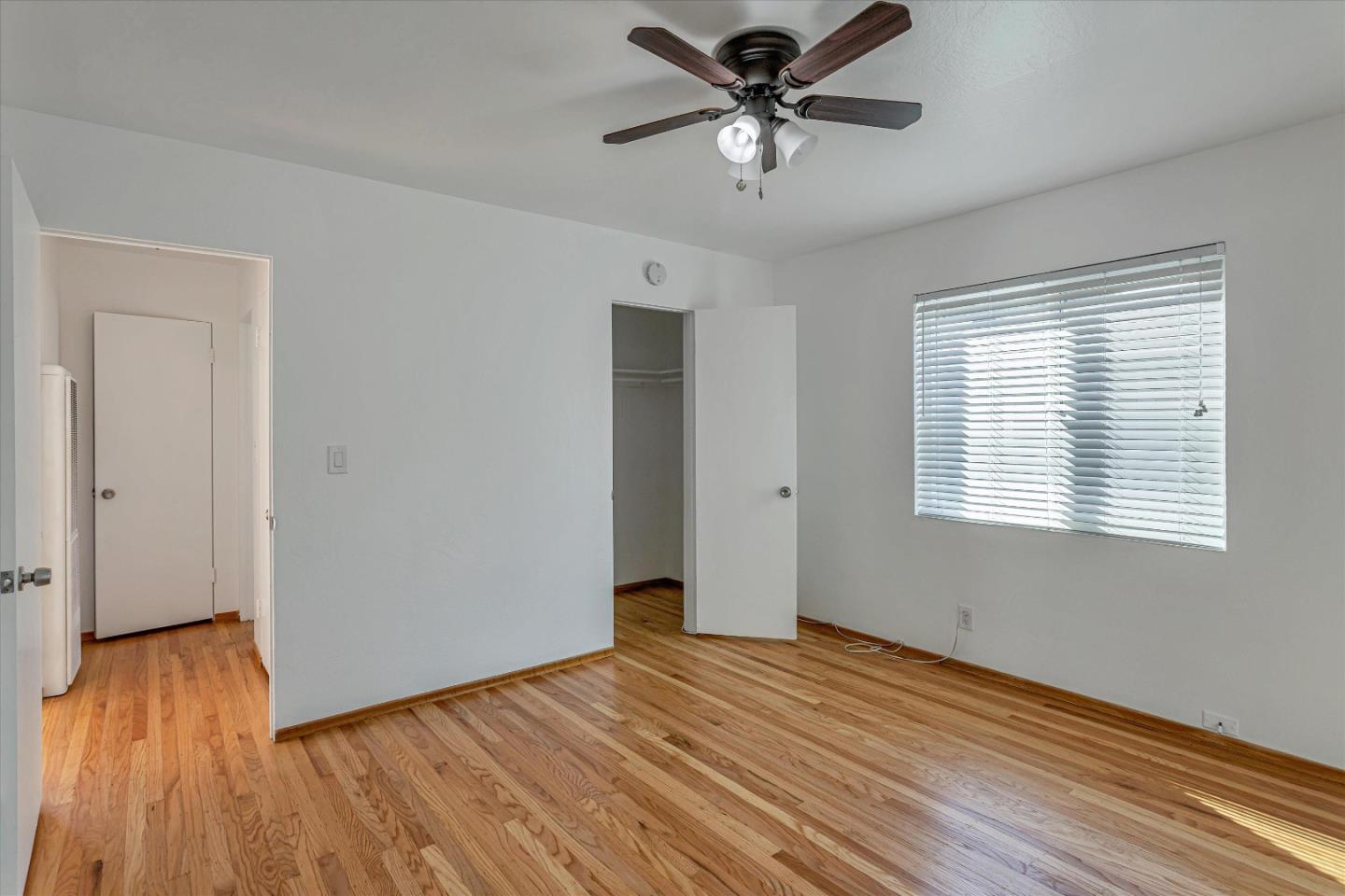245 Bush Street Mountain View, CA 94041 - Photo 14 of 33 a view of empty room with wooden floor and fan