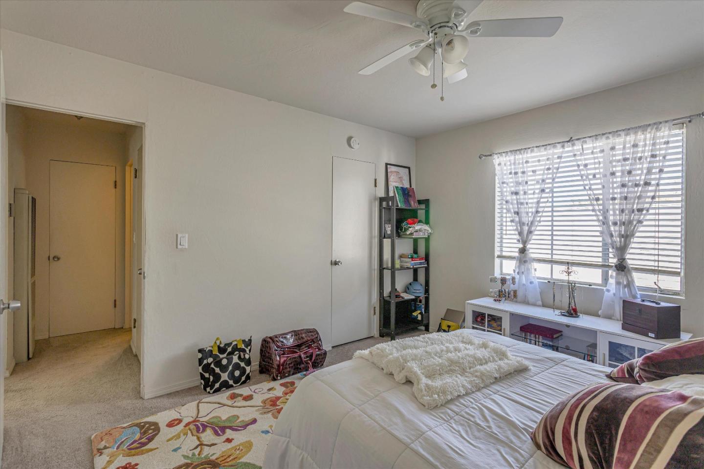 245 Bush Street Mountain View, CA 94041 - Photo 18 of 33 a bedroom with two beds and a chandelier