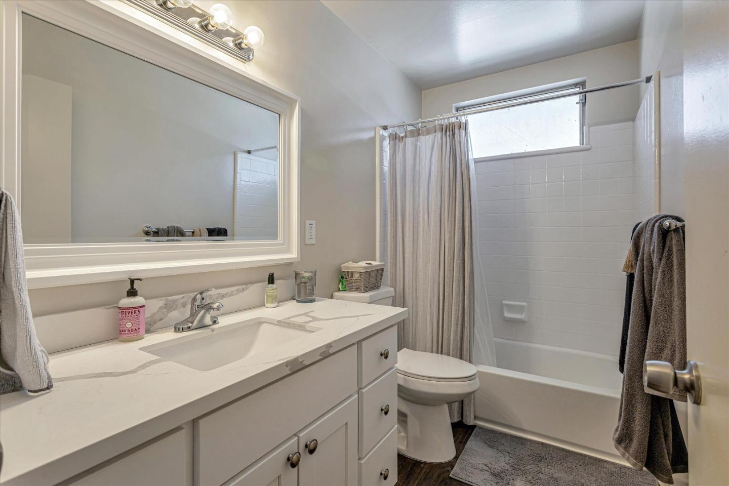 245 Bush Street Mountain View, CA 94041 - Photo 21 of 33 a bathroom with a sink toilet and shower