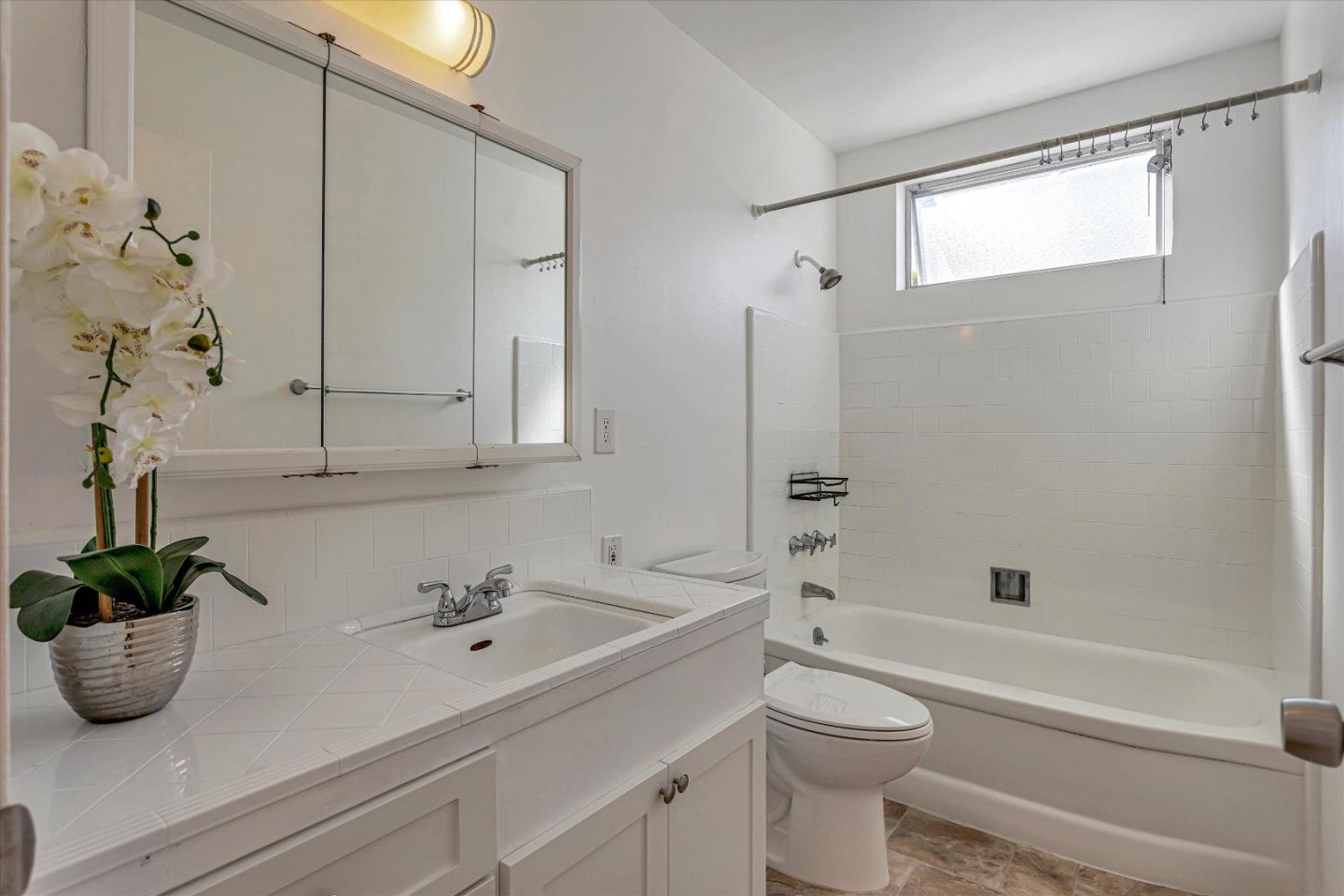 245 Bush Street Mountain View, CA 94041 - Photo 23 of 33 a bathroom with a sink a toilet and shower