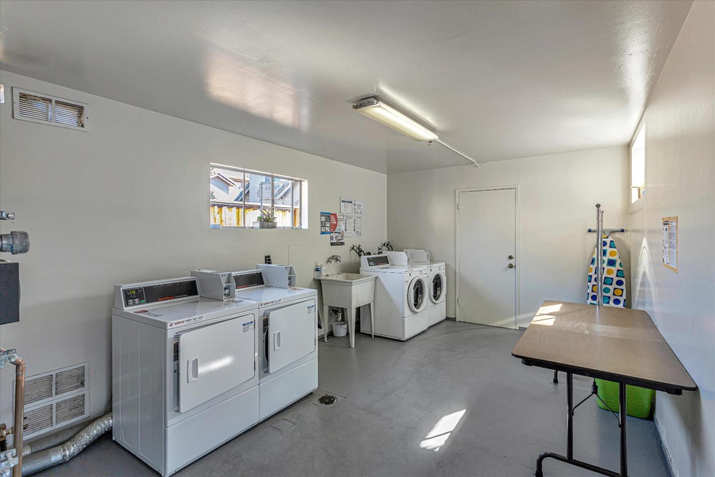 245 Bush Street Mountain View, CA 94041 - Photo 24 of 33 a bed room with furniture and a window
