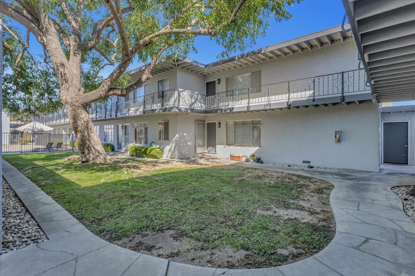 245 Bush Street Mountain View, CA 94041 - Photo 8 of 33 a view of a white house with a sink and garden