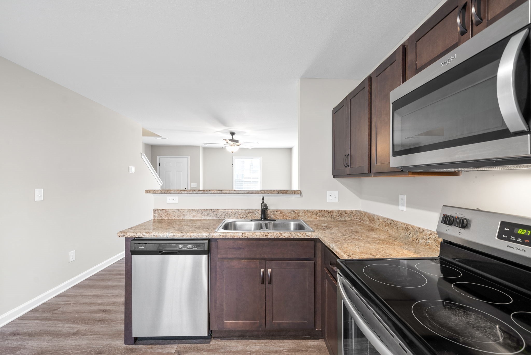264 Smithson Lane, Unit B Clarksville, TN 37040 - Photo 11 of 25 a kitchen with sink a microwave a stove and cabinets