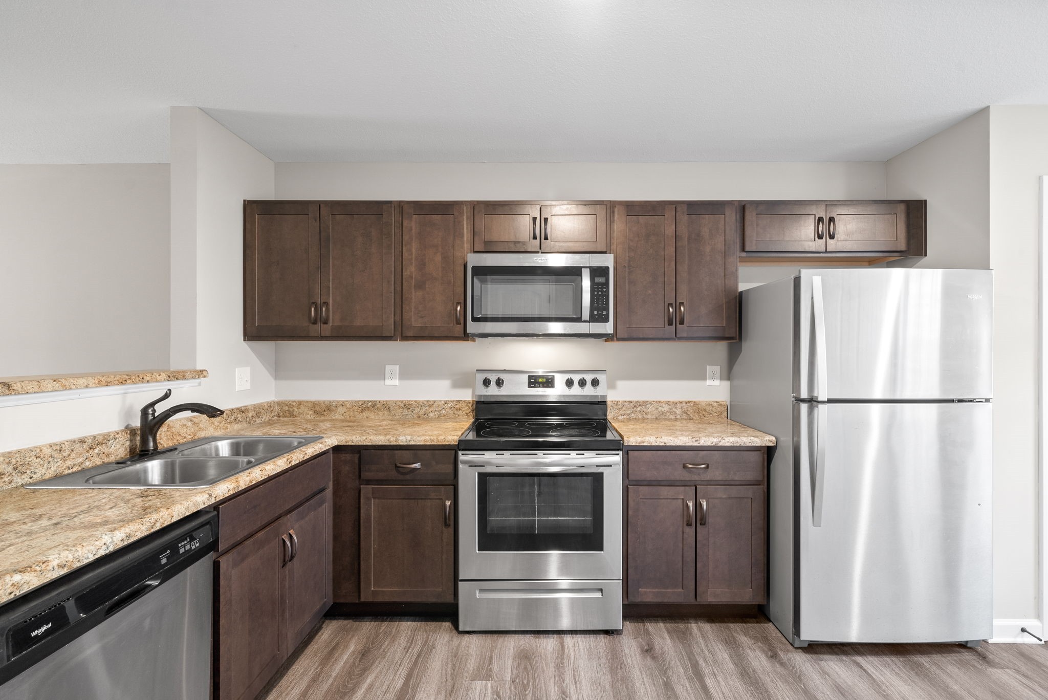 264 Smithson Lane, Unit B Clarksville, TN 37040 - Photo 12 of 25 a kitchen with a sink stove and refrigerator