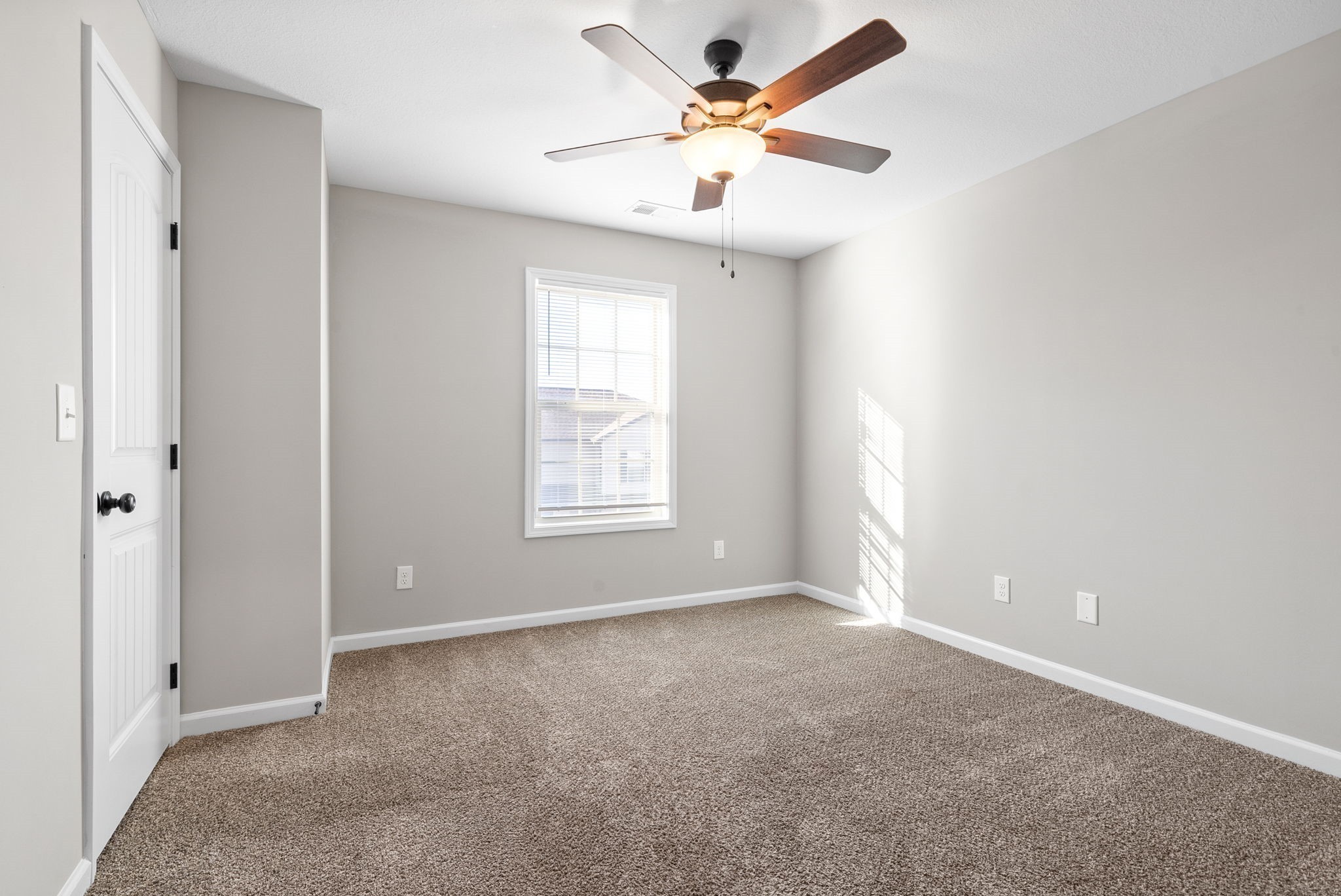 264 Smithson Lane, Unit B Clarksville, TN 37040 - Photo 20 of 25 an empty room with a window and a fan