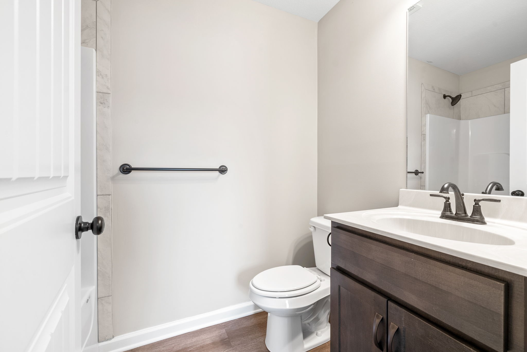 264 Smithson Lane, Unit B Clarksville, TN 37040 - Photo 22 of 25 a bathroom with a sink a toilet and a mirror