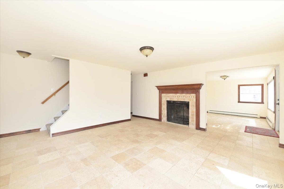 9 Cabot Road West Massapequa, NY 11758 - Photo 12 of 41 a view of a livingroom with an empty space