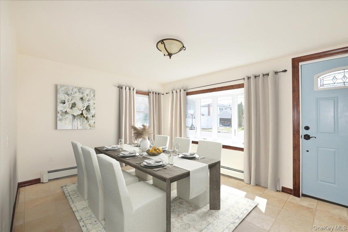 9 Cabot Road West Massapequa, NY 11758 - Photo 13 of 41 a view of a dining room with furniture window and outside view